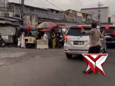 PENGATURAN ARUS LALU LINTAS DI SIMPANG TIGA PASAR MAESAN