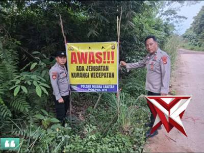 Polsek muara Lakitan melaksanakan pemasangan banner himbauan lalulintas 12