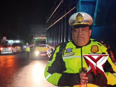 PENEGURAN kendaraan sumbu 3